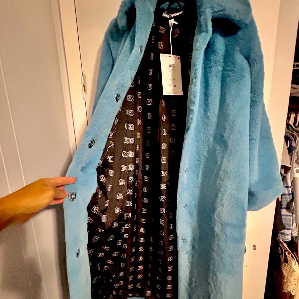 Full length blue faux fur coat; fully lined, snap closure and of course pockets!